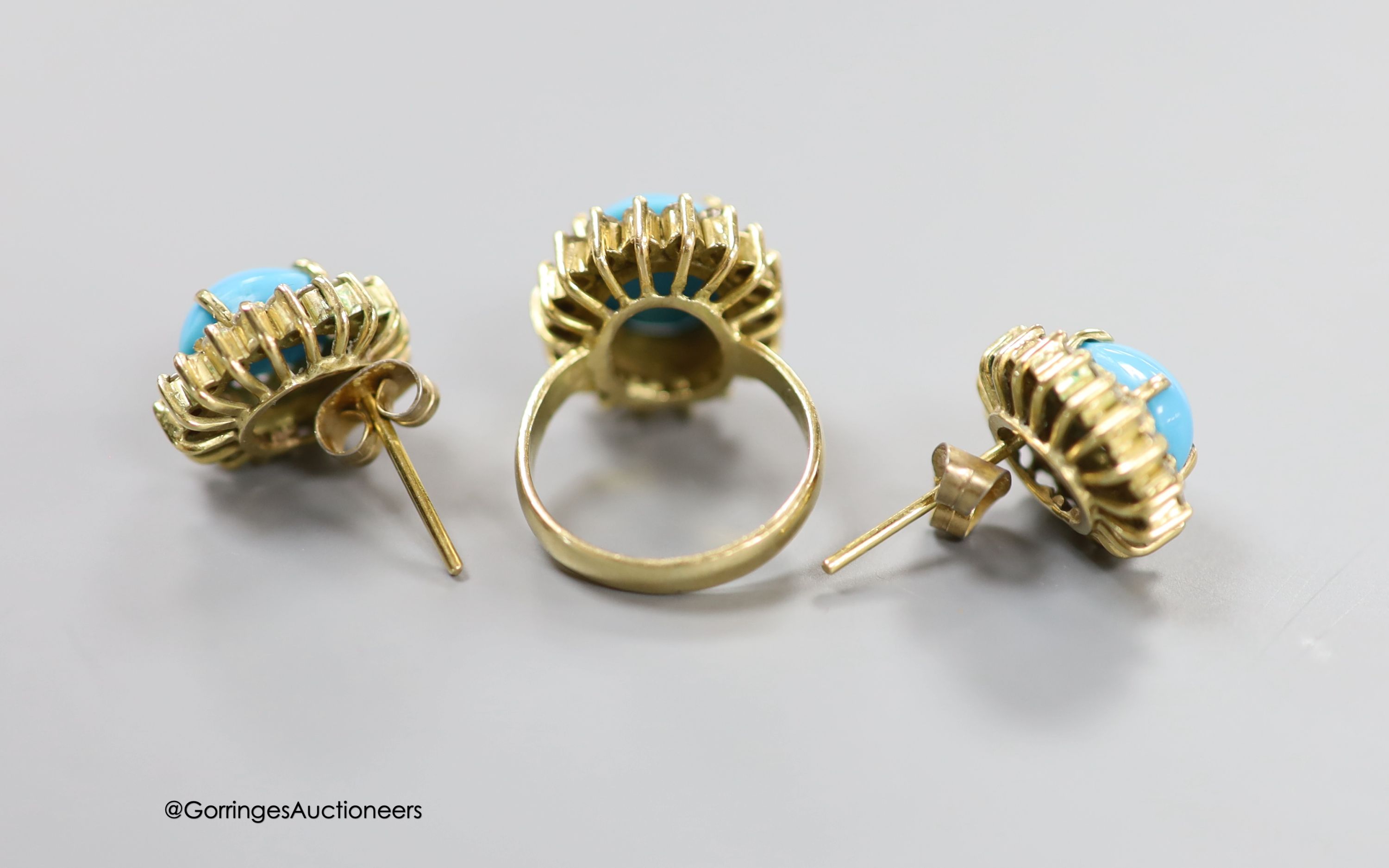 A modern yellow metal, turquoise and diamond set oval dress ring, size G and a pair of matching ear studs, 14mm, gross 14.6 grams.